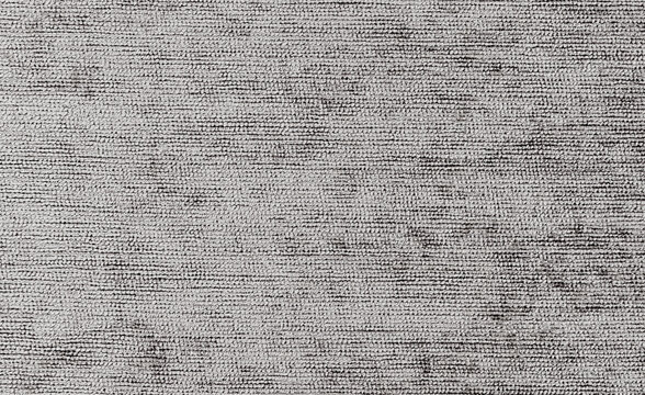 Ribbed gray knit texture with thick yarn loops in parallel rows and dark gaps between threads, a coarse fabric background with an uneven raised surface for textured artwork