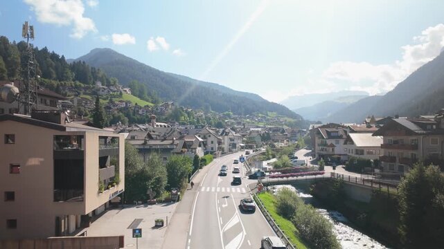Elevated Perspective Showing Traffic Moving Along Road in Alpine Mountain Village