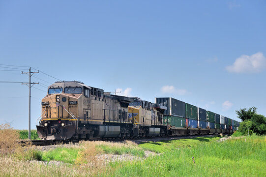 Two Union Pacific Railroad locomotives provide front-end power for an intermodal freight train traveling northbound through northeastern Illinois while destined for Chicago.
