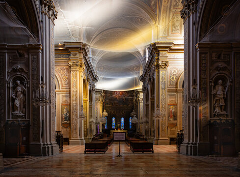 Ferrara Cathedral nave with light ray illuminating restoration
