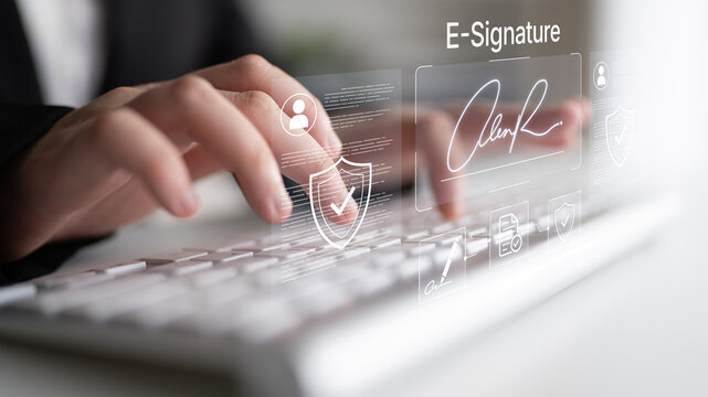A close-up of hands typing on a keyboard, featuring e-signature technology and digital interface elements to highlight modern documentation and secure transaction processes. Nascent