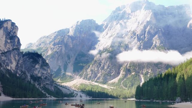 Scenic Handheld View of Pragser Wildsee Lake Braies with Wooden Rowboats