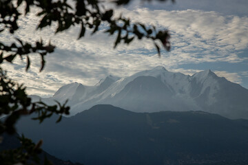 Mont blanc peak rising above mountain range at sunset © Valenti