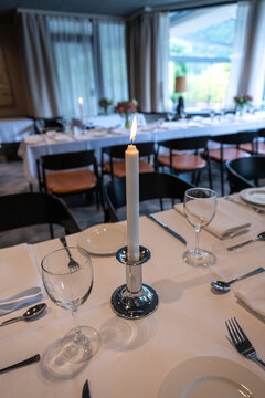 A beautifully arranged dining table in a fine dining restaurant, set for a romantic meal or special occasion. 