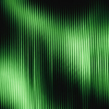 Vertical fluted glass pattern illuminated by green light creating a textured striped visual effect with vertical