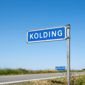 Clear Blue Sky Over Kolding Road Sign In Rural Denmark