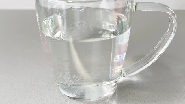 Effervescent Tablet Dissolving in a Glass of Water