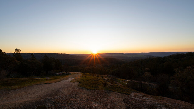 Sunstar Sunset Over Granite Rocks Lookout in Beechworth Victoria Australia