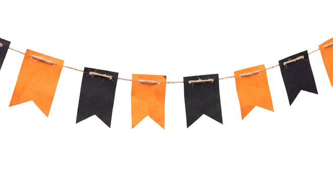 Festive Halloween bunting banner with orange and black paper flags hanging on a rustic twine string