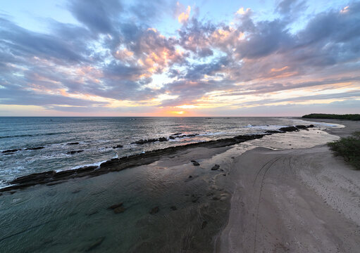 Rocks in coaastline of ocean at sunset light