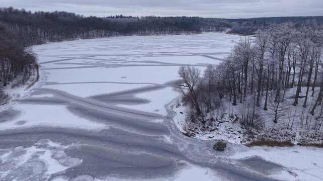 Winter landscape of the frozen lake in Poland.