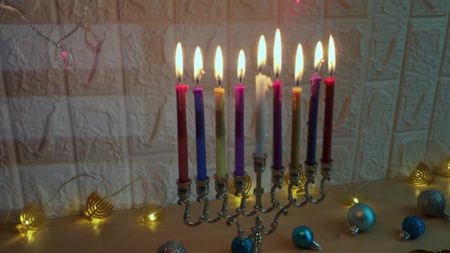 Burning hanukkah menorah with nine candles