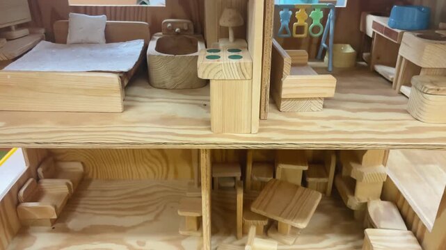 Miniature scene featuring elaborate woodwork and cozy furnishings, Small handcrafted dollhouse setting showcasing fine wood craftsmanship and inviting decor. User generated content.