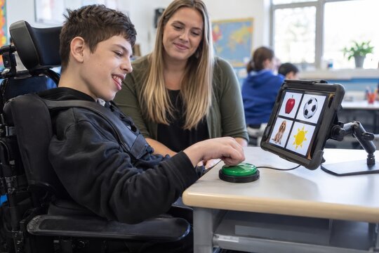 Teenager using assistive switch for learning