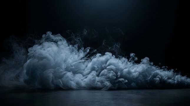 Thick grey smoke clouds rolling across a dark surface in a moody and mysterious studio setting with mysterious atmosphere abstract