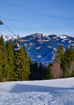Gondola cabins above a ski piste at Zell am See Austria