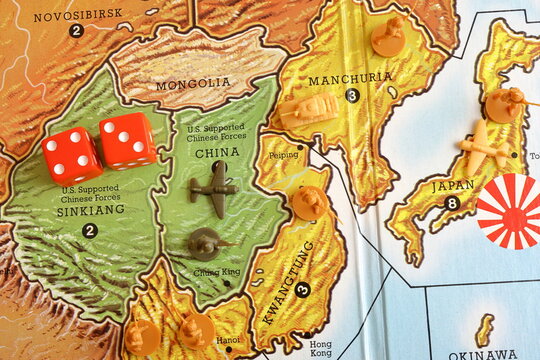 Axis and Allies. Strategy military board game about World war 2. Combat concept in Asia.