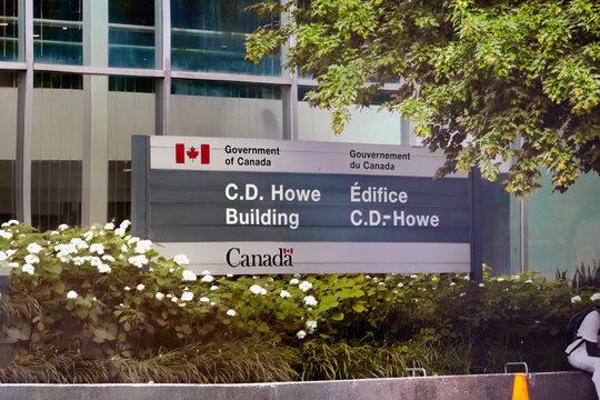 Ottawa, Ontario, Canada. September 18, 2026. Exterior sign for the Government of Canada C.D. Howe Building surrounded by greenery.