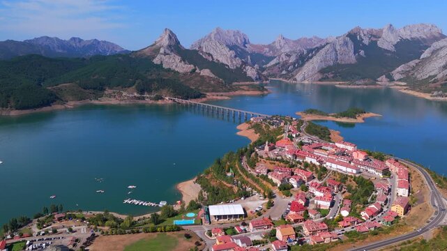 Summer rural tourism in the village of Ria&ntilde;o in Le&oacute;n, Spain. Aerial view of riano village and reservoir in picos de europa national park
