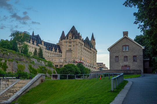 Ottawa, Ontario, Canada. September 18, 2026. Exterior view of the historic Ch&acirc;teau Laurier hotel castle and stone building from a park path.