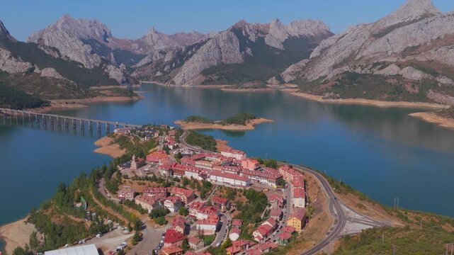 Summer rural tourism in the village of Ria&ntilde;o in Le&oacute;n, Spain. Aerial view of riano village on a reservoir in spain