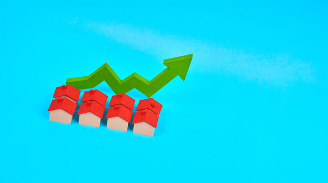 Miniature houses beneath an upward arrow represent property appreciation and continued growth in the housing market.
