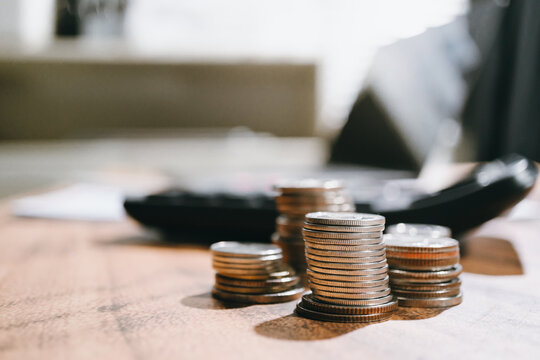 Professional financial business growth concept showing stacked metal coin currency for savings success and wealth investment planning
