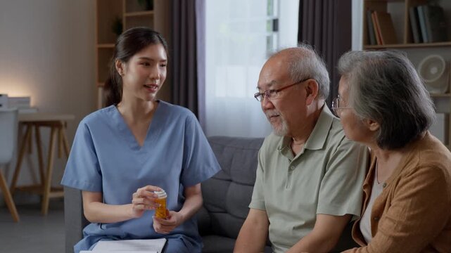 Asian female nurse explaining prescription medication dosage to senior man