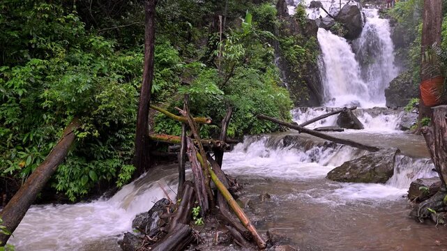 Huai Nam Yen Waterfall cascading through lush tropical rainforest in the rainy season in Omkoi District Chiang Mai, Thailand