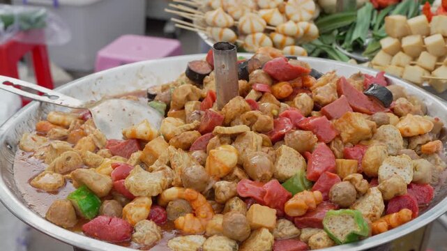 Colorful assortment of cooked street food on a plate