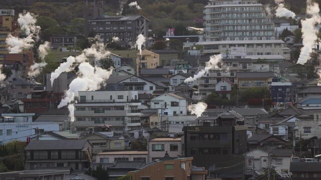 Beppu, Japan, city panorama skyline, Kannawa onsen distict, Oita prefecture, Kyushu island region, Yukemuri observation deck, rising hot steam from onsen ryokan bath houses, Beppu resort hot springs