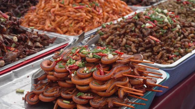 Assorted grilled sausages and street food at a market