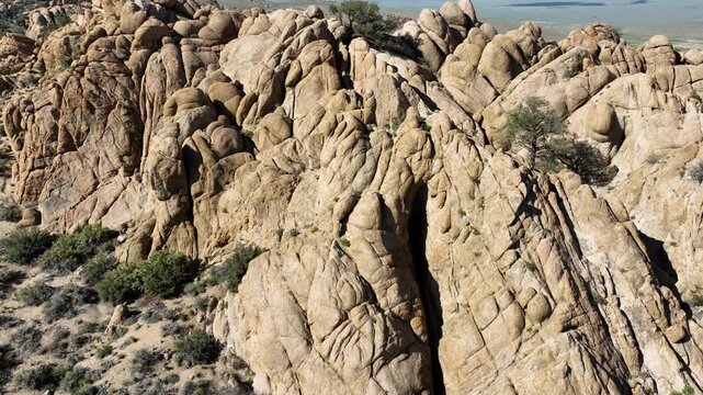 Aerial shot of interesting rock formations in the desert north of Bishop California