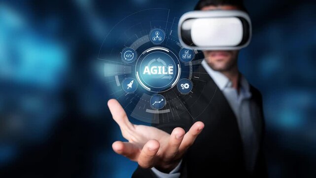 A business professional wearing a virtual reality headset interacts with an agile technology concept, symbolizing innovation and digital transformation in the workplace. Raster