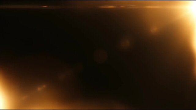 Golden cinematic light leak footage with glowing blurry border on black background loop