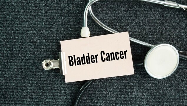 Stethoscope and paper with the words Bladder cancer is a common malignancy that begins in the cells lining the inside of the bladder