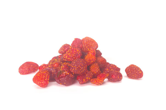 Heap of dried strawberries isolated on a white background