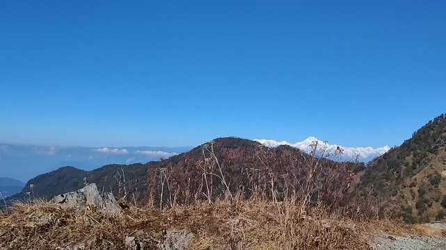 Kanchenjunga snow mountain range view from Sikkim Himalayas with blue sky