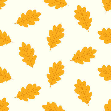 Seamless pattern of yellow oak leaves on white background