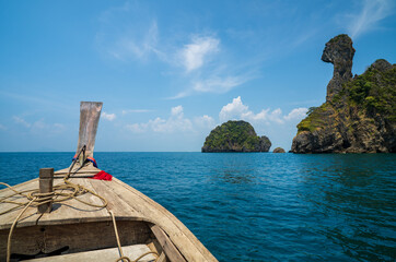 chicken island or koh khai at krabi amazing in thailand with old traditional head wooden long tail boat or tourist and fishing boat in deep blue sea and sky or ocean marine for travel holiday vacation © kornnphoto