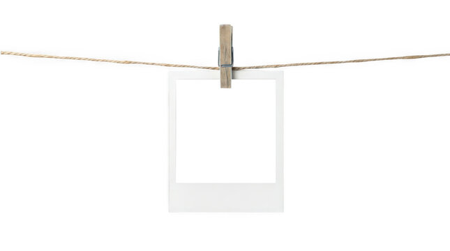 Blank instant photo frame on a clothesline isolated on transparent background