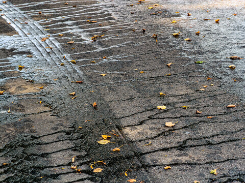asphalt road surface after watering by sweeper machine. high-detailed texture.