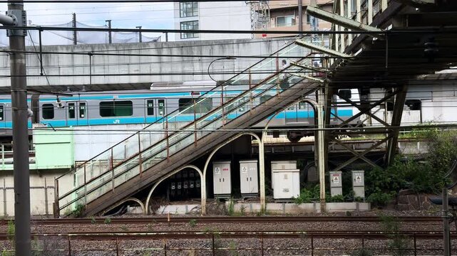 Takasaki Line and Keihin-Tohoku Line Passing Beneath the Asukayama-shita Pedestrian Rail Overpass in Tokyo