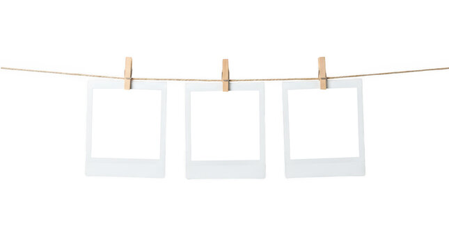 Blank photo frames hanging on a rope isolated on transparent background