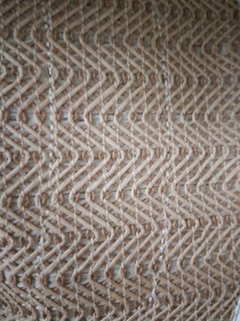 Detailed natural woven pattern and texture background, beige wicker surface
