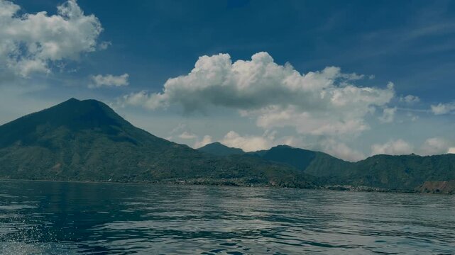 View of Atitlan Volcano filmed from the water on a sunny day