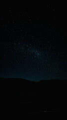 Fototapeta premium Starry night sky over mountain silhouettes in Chapada Diamantina, Bahia, Brazil