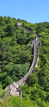 Tourist hiking along stone ramparts on the Great Wall of China