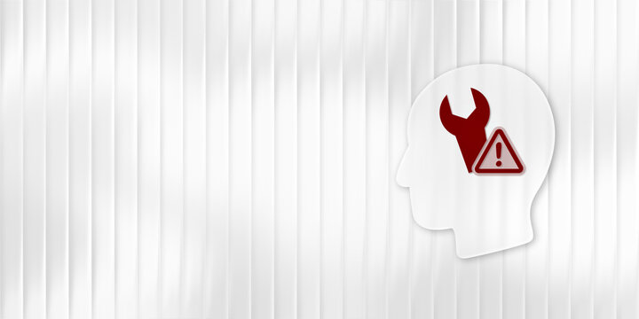 Mental health troubleshooting concept with a red wrench and warning sign inside a white human head silhouette on striped wall with copy space for messaging