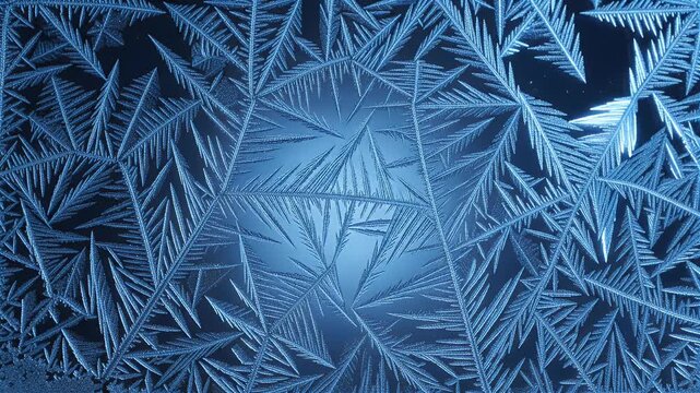 detailed blue frost patterns forming intricate ice crystals on glass, creating a beautiful winter texture, perfect for seasonal design elements